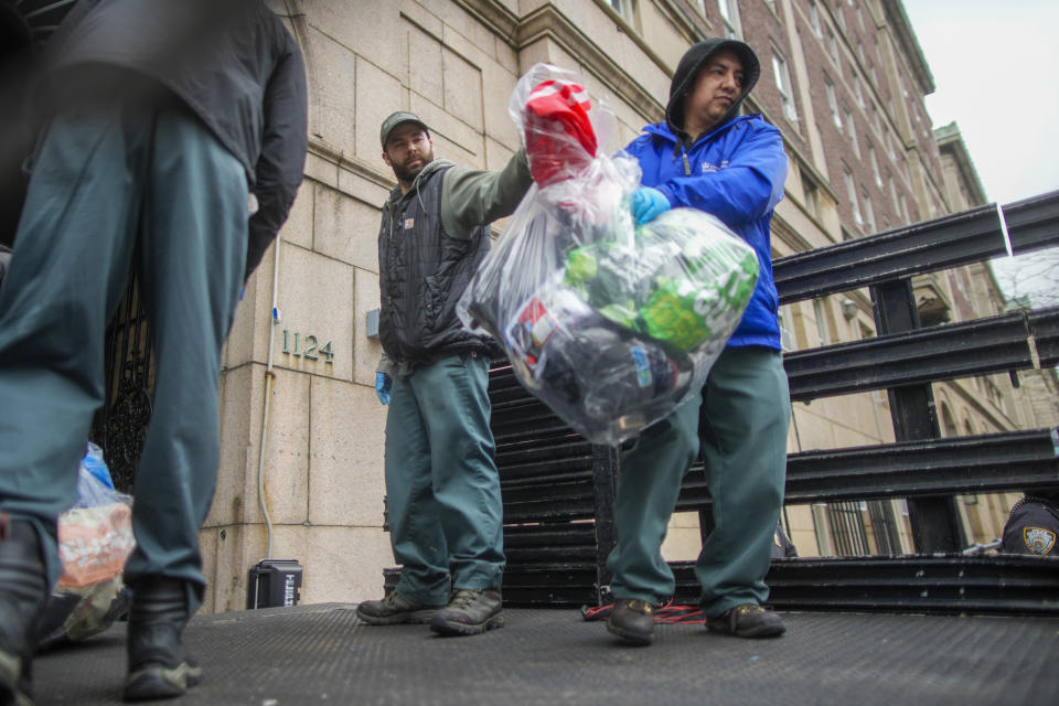 Men load a truck with the belongings of demonstrators who participated in an encampment on the Columbia University campus, Thursday, April 18, 2024, in New York. The protestors were calling for the school to divest from corporations they claim profit from the war in the Middle East. (AP Photo/Mary Altaffer)