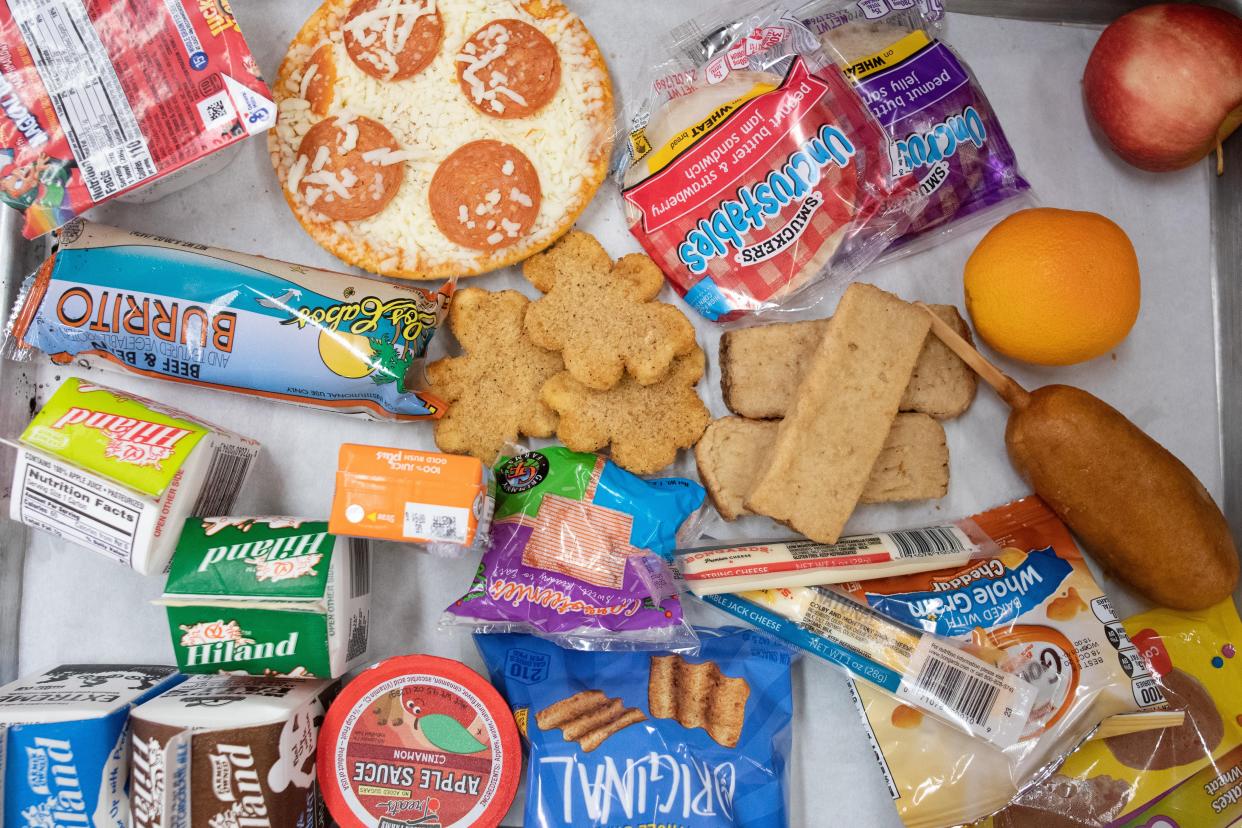 Various food items are displayed on a tray Friday inside Topeka High School as USD 501 begins its summer meals program.