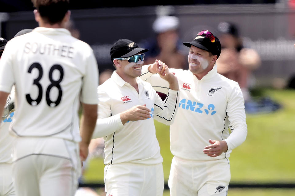 Tom Latham of New Zealand celebrates after holding a catch during play on day three of the second cricket test between Bangladesh and New Zealand at Hagley Oval in Christchurch, New Zealand, Tuesday, Jan. 11, 2022. (Martin Hunter/Photosport via AP)