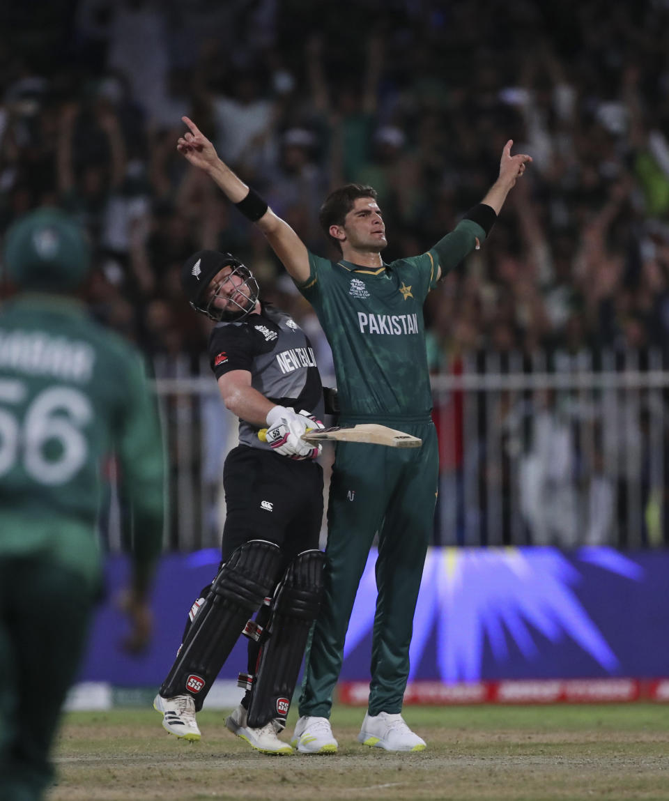 Pakistan's Shaheen Afridi celebrates the dismissal of New Zealand's Tim Seifert during the Cricket Twenty20 World Cup match between New Zealand and Pakistan in Sharjah, UAE, Tuesday, Oct. 26, 2021. (AP Photo/Aijaz Rahi)