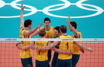 LONDON, ENGLAND - AUGUST 06: Australia celebrates after they won the second set against Poland during Men's Volleyball on Day 10 of the London 2012 Olympic Games at Earls Court on August 6, 2012 in London, England. (Photo by Elsa/Getty Images)