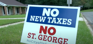 St. George Protest Sign - Screenshot: Youtube/ BRProud News - NBC Local 33 / Fox44