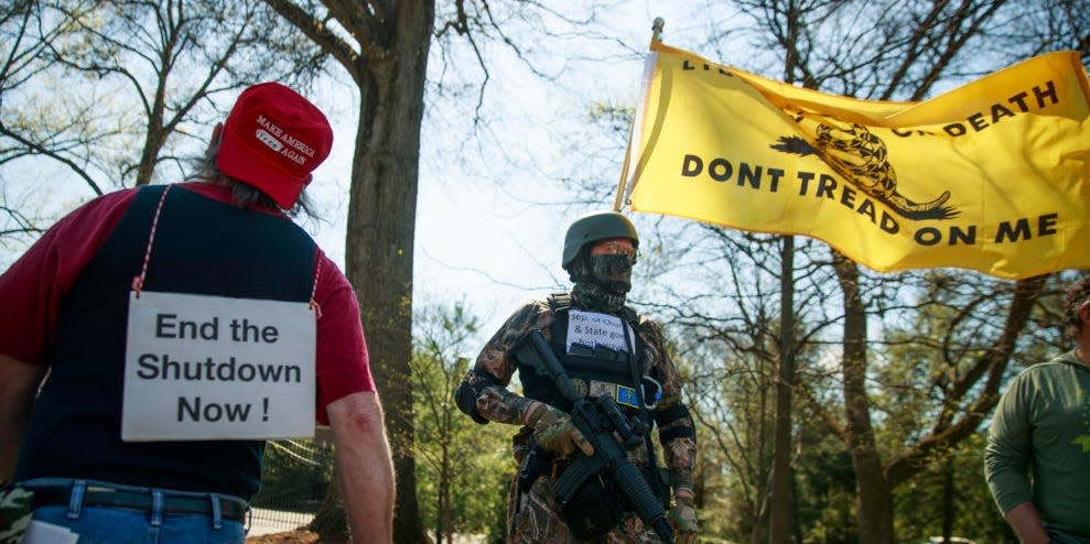 Man with gun protest coronavirus public health measures in Indiana