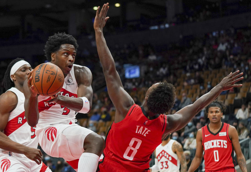 Toronto Raptors forward OG Anunoby (3) is called for an offensive foul against Houston Rockets forward Jae'Sean Tate (8) during first-half preseason NBA basketball game action in Toronto, Monday, Oct. 11, 2021. (Evan Buhler/The Canadian Press via AP)