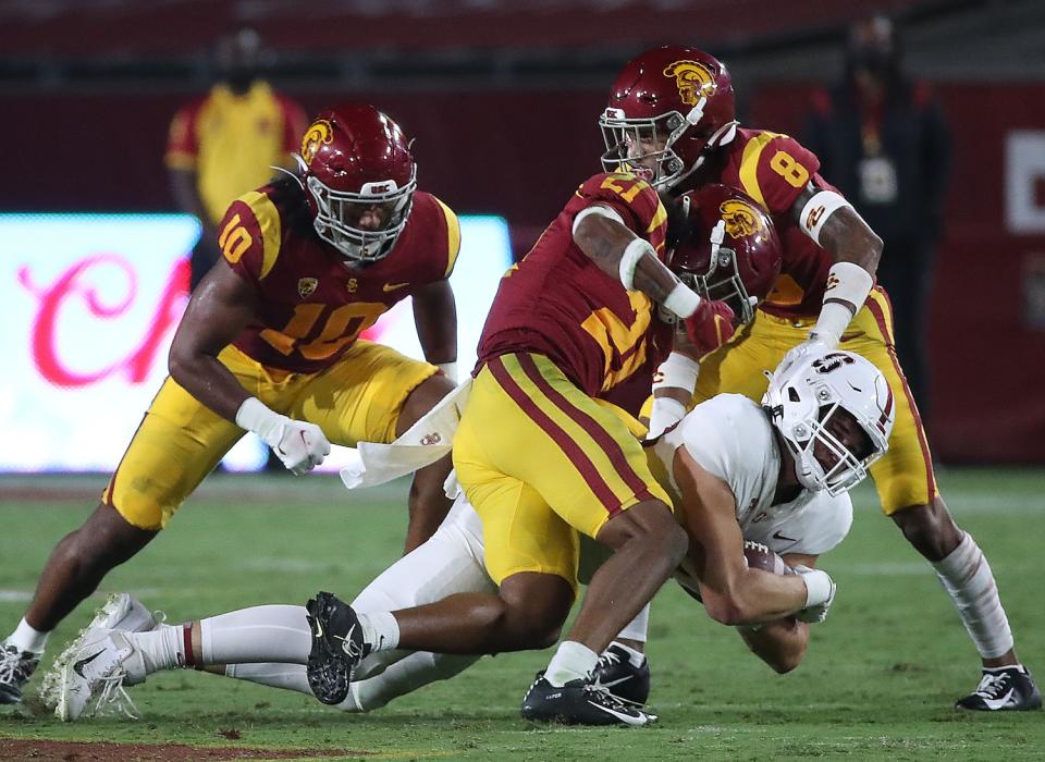 Stanford tight end Benjamin Yurosek makes a catch against a trio of USC defenders in the fourth quarter