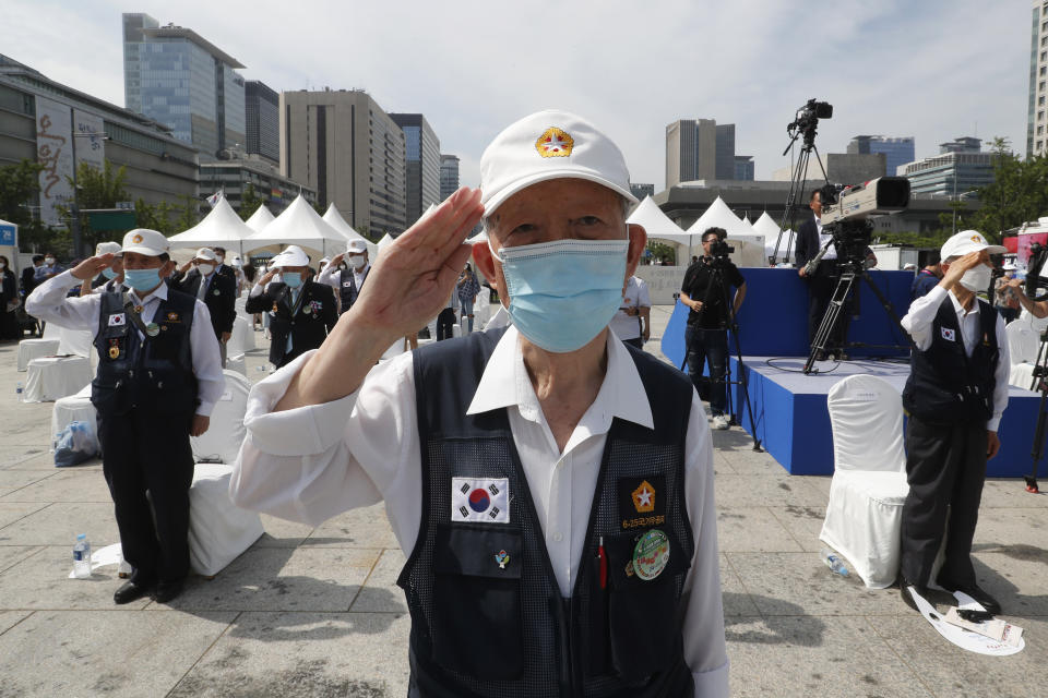 Korean War veterans of South Korea salute during a ceremony to unveil an installation artwork to commemorate the upcoming 70th anniversary of the Korean War, in Seoul, South Korea, Monday, June 15, 2020. South Korea on Sunday convened an emergency security meeting and urged North Korea to uphold reconciliation agreements, hours after the North threatened to demolish a liaison office and take military action against its rival. (AP Photo/Ahn Young-joon)