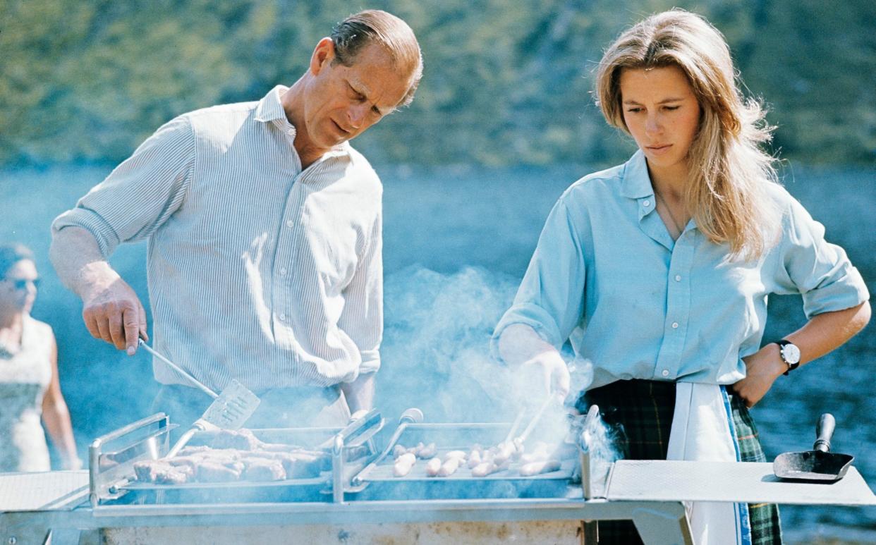  HRH The Duke of Edinburgh and HRH The Princess Anne preparing a barbecue on the Estate at Balmoral Castle, Scotland during the Royal Family's annual summer holiday, 22nd August 1972. - Lichfield/Getty Images