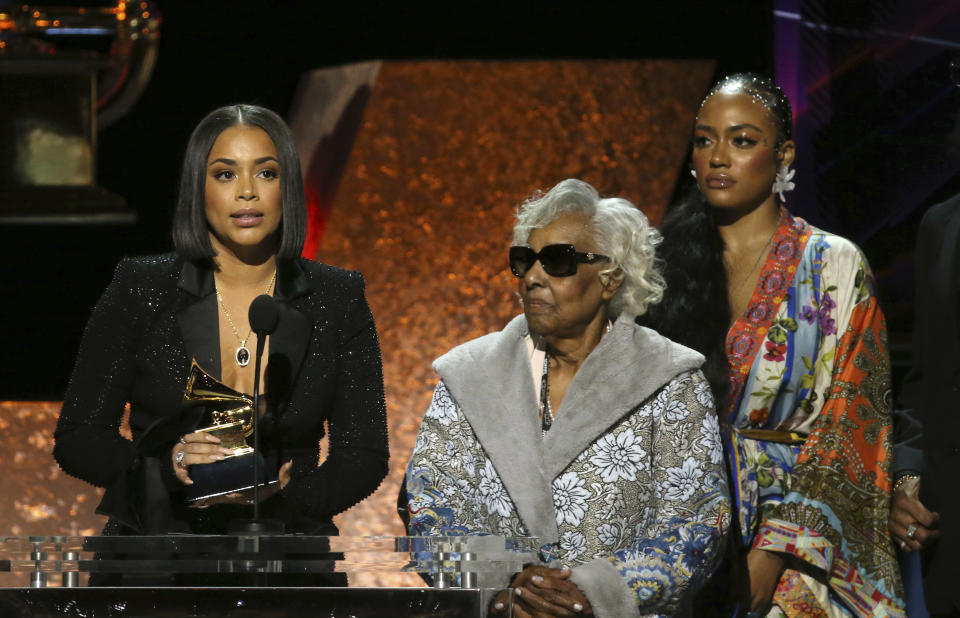Lauren London, from left, Margaret Boutte, and Samantha Smith accept the award for best rap performance for "Racks in the Middle" on behalf of Nipsey Hussle at the 62nd annual Grammy Awards on Sunday, Jan. 26, 2020, in Los Angeles. (Photo by Matt Sayles/Invision/AP)