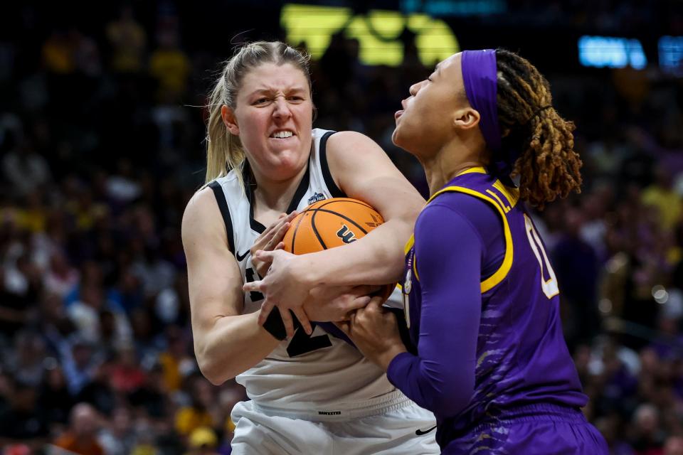 Iowa center Monika Czinano, left, battles for the ball with LSU forward LaDazhia Williams during the NCAA women's national championship game.