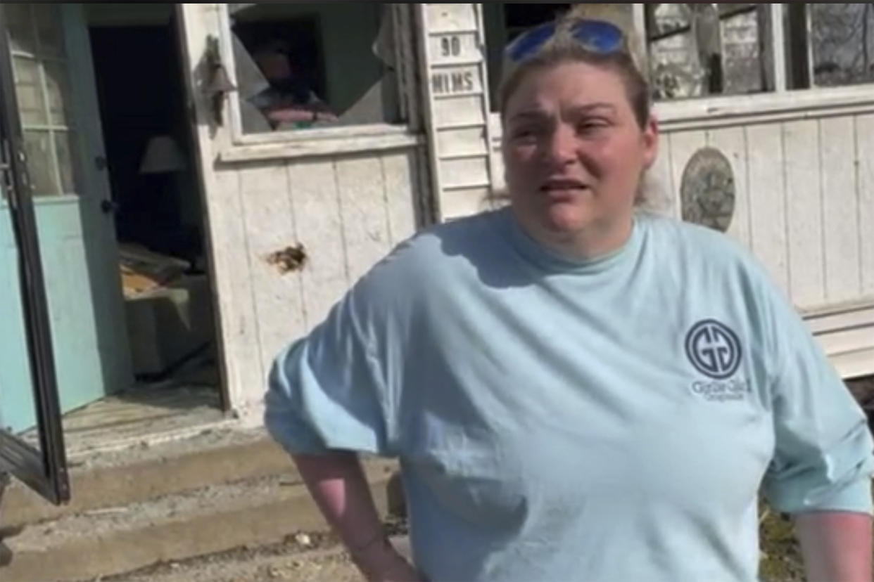 Christin George, describes how her parents and grandmother survived the tornado on Saturday, March 25, 2023 in Silver City, Miss. Emergency officials in Mississippi say several people have been killed by tornadoes that tore through the state on Friday night, destroying buildings and knocking out power as severe weather produced hail the size of golf balls moved through several southern states. (AP Photo/Michael Goldberg)