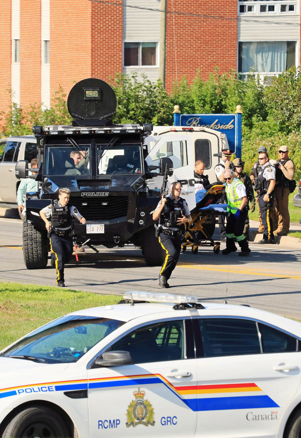 <p>Constables Robb Costello and Sara Burns were killed while responding to a report of gunfire at an apartment complex on the city’s north side the morning of Aug. 10.<br>They were the first on the scene and were gunned down as they approached slain civilians Donnie Robichaud, 42, and his girlfriend, Bobbie Lee Wright, 32.<br>The alleged shooter, Matthew Vincent Raymond, was quickly arrested but a heavy police presence surrounded the building for the rest of the day. (Photo from The Canadian Press/Keith Minchin) </p>