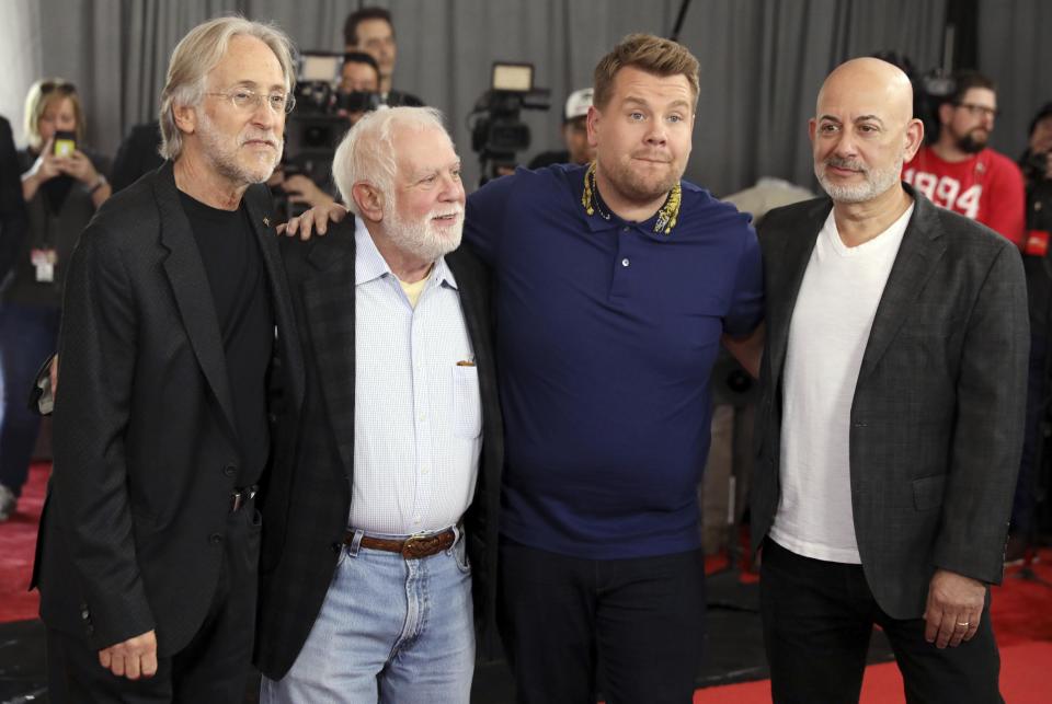 Neil Portnow, president of the Recording Academy, from left, executive producer Ken Ehrlich, host James Corden, and Jack Sussman, CBS Executive Vice President, Specials, Music, and Live Events, pose for a photo after rolling out the red carpet for the 59th Annual Grammy Awards on Thursday, Feb. 9, 2017 in Los Angeles, The Grammy Awards will take place on Sunday, Feb. 12. (Photo by Matt Sayles/Invision/AP)