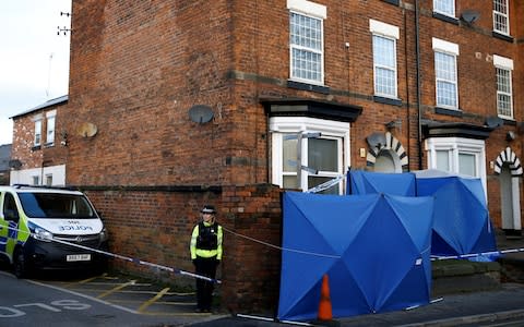 A police officer stands next to forensic tents outside a property, which was searched in connection with stabbing on London Bridge, in Stafford - Credit: Reuters&nbsp;