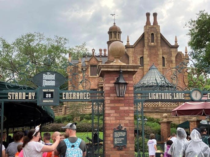 Guests line up for the Haunted Mansion at Disney World.
