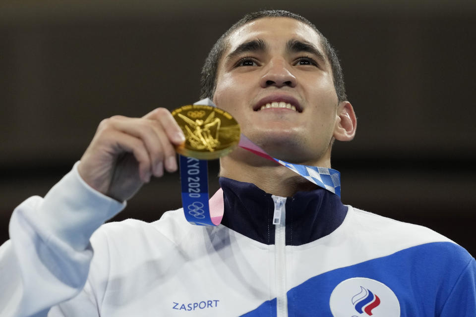 Albert Batyrgaziev, of the Russian Olympic Committee, holds his gold medal after defeating Duke Ragan, of the United States, in their final round feather weight 52-57kg boxing match at the 2020 Summer Olympics, Thursday, Aug. 5, 2021, in Tokyo, Japan. (AP Photo/Themba Hadebe)