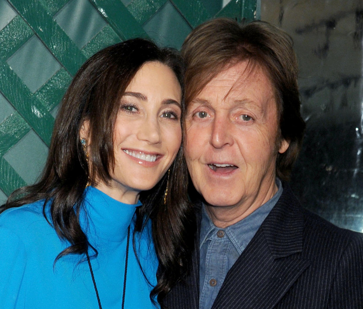 WEST HOLLYWOOD, CA - APRIL 13:  Musician Paul McCartney (R) and wife Nancy Shevell arrive at the world premiere of 