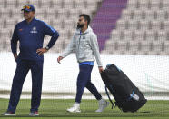 India's captain Virat Kohli, right, walks past team coach Ravi Shastri before batting in the nets during a training session ahead of their Cricket World Cup match against South Africa at Ageas Bowl in Southampton, England, Monday, June 3, 2019. (AP Photo/Aijaz Rahi)