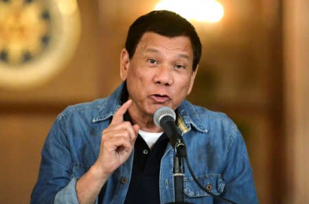 FILE PHOTO: Philippine President Rodrigo Duterte announces the disbandment of police operations against illegal drugs at the Malacanang palace in Manila, Philippines early January 30, 2017.    REUTERS/Ezra Acayan/File Photo