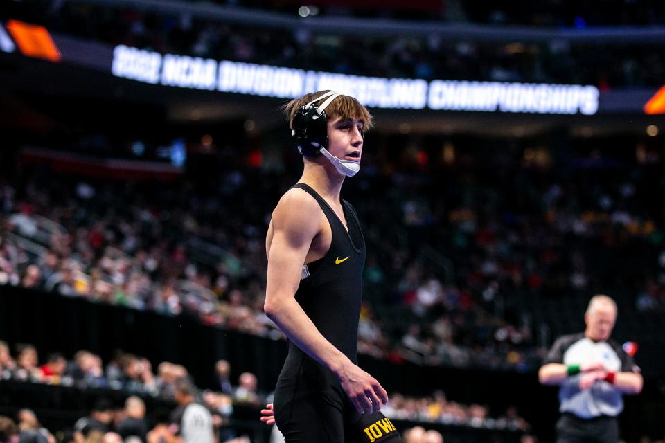 Iowa's Drake Ayala is introduced before his match at 125 pounds during the first session of the NCAA Division I Wrestling Championships, Thursday, March 17, 2022, at Little Caesars Arena in Detroit, Mich.