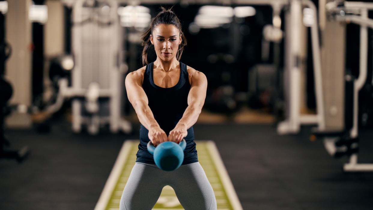  Woman doing a kettlebell swing 