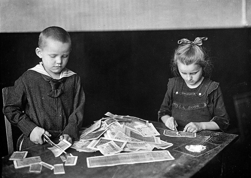 German children playing with banknotes rendered valueless through hyperinflation, circa 1919. Albert Harlingue/Roger Viollet/Getty Images