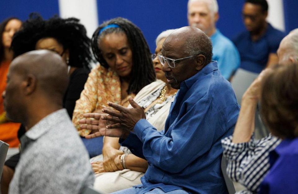 Lenworth Anglin, center, asks Jacqueline Charles, Haiti/Caribbean Correspondent at the Miami Herald, a question during An Evening with Jacqueline Charles where she speaks to the community about Haiti’s past and future on Thursday, May 30, 2024, at African Heritage Cultural Arts in Miami.