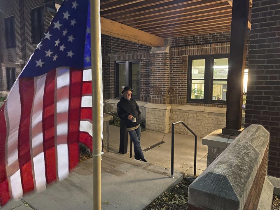 Larry Long of Minneapolis was the first voter in line at Holy Trinity Church Tuesday, Nov. 2,2021 to cast his vote in Ward 2 in Minneapolis. Voters in Minneapolis are deciding whether to replace the city’s police department with a new Department of Public Safety. The election comes more than a year after George Floyd’s death launched a movement to defund or abolish police across the country. (David Joles /Star Tribune via AP)