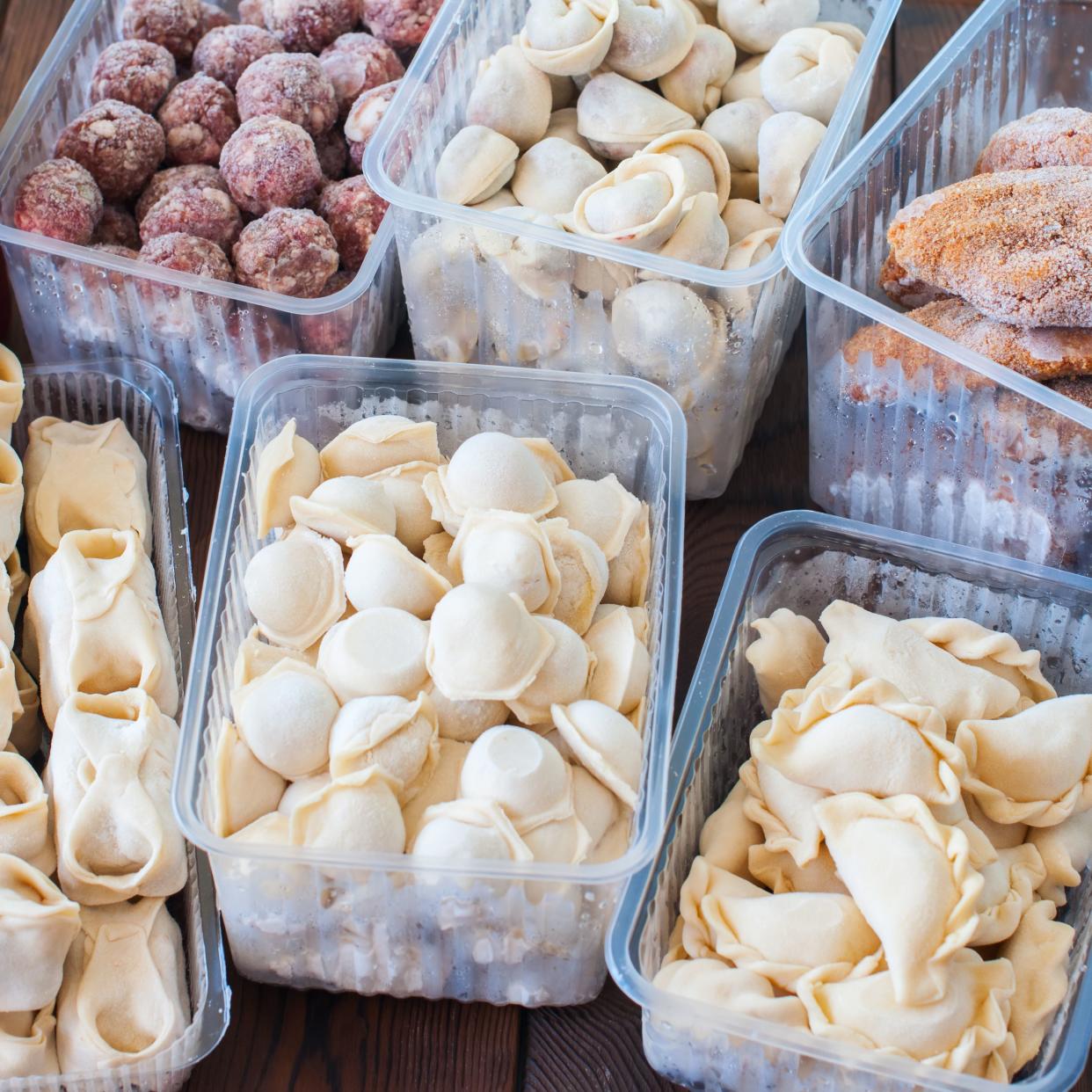 Assortment of Pocket items. Semifinished meatballs, dumplings, pierogi in plastic containers.