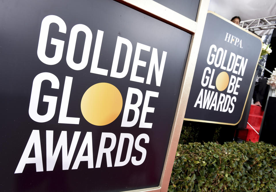 FILE - In this Jan. 6, 2019 file photo, Golden Globes signage appears on the red carpet at the 76th annual Golden Globe Awards in Beverly Hills, Calif. The Hollywood Foreign Press Association says the ceremony will be held Feb. 28. (Photo by Jordan Strauss/Invision/AP, File)