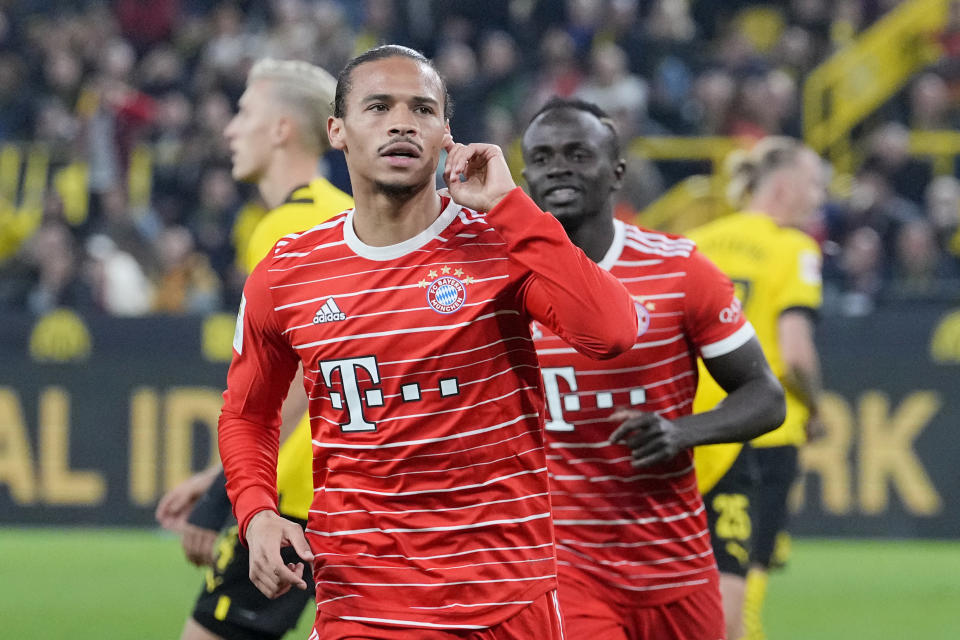 Bayern&#39;s Leroy Sane celebrates after scoring his side&#39;s second goal during the German Bundesliga soccer match between Borussia Dortmund and Bayern Munich in Dortmund, Germany, Saturday, Oct. 8, 2022. (AP Photo/Martin Meissner)