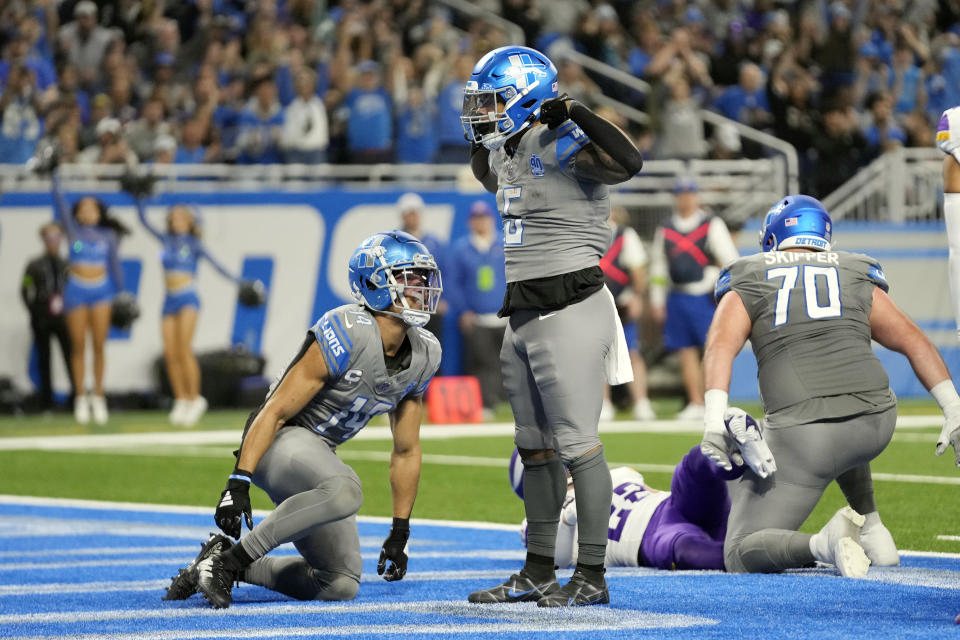 Detroit Lions running back David Montgomery (5) reacts after scoring on a 1-yard rush during the second half of an NFL football game against the Minnesota Vikings, Sunday, Jan. 7, 2024, in Detroit. (AP Photo/Paul Sancya)