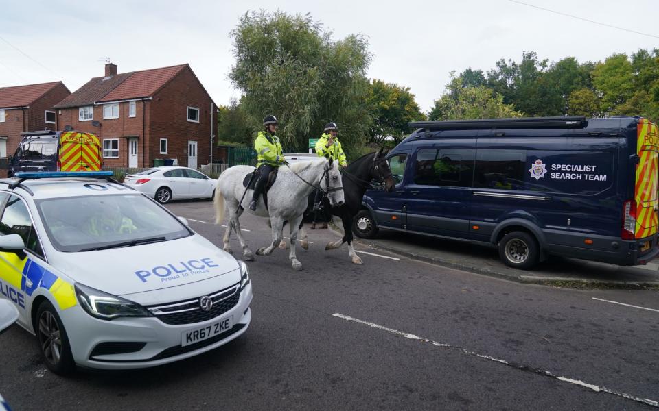 Mounted police patrol the area close to the scene on Aycliffe Crescent, Gateshead, where a 14-year-old boy was fatally attacked - Owen Humphreys/PA