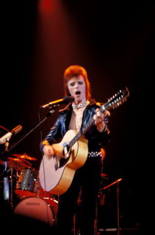 <p>John Lynn Kirk/Redferns</p> David Bowie onstage in September 1972