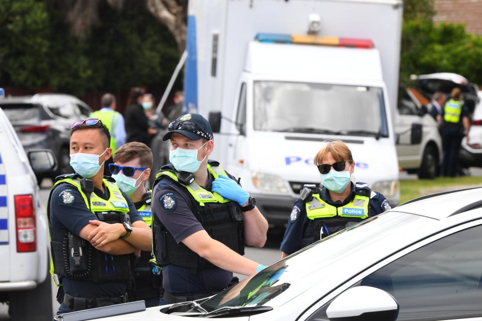 Victoria Police work at a crime scene in Tullamarine, Melbourne.