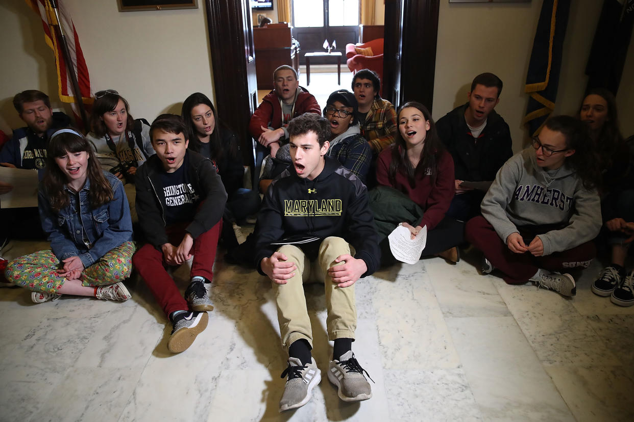 Students sit and protest in front of Senate Majority Leader Mitch McConnell's office in Washington, D.C., to urge Congress to change gun laws in the wake of the shooting in Parkland, Florida, last month. (Photo: Mark Wilson/Getty Images)