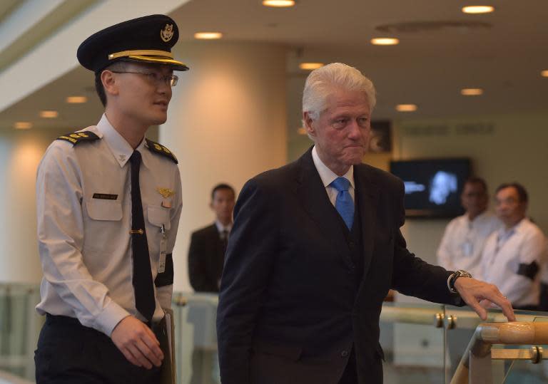 Former US president Bill Clinton arrives at the University Cultural Center (UCC) for the funeral services for Singapore&#39;s former prime minister Lee Kuan Yew in Singapore on March 29, 2015