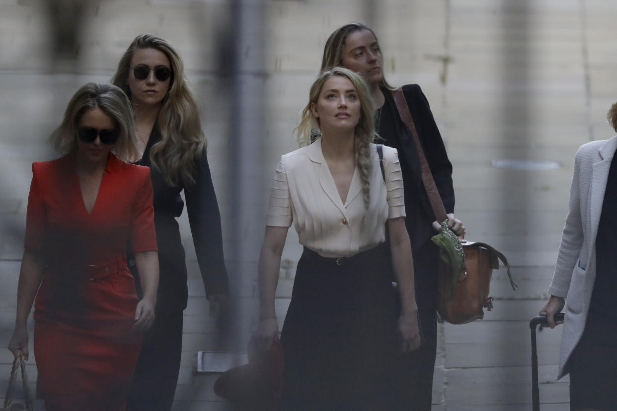 Actress Amber Heard arrives at the High Court in London, Monday, July 20, 2020. Amber Heard started Monday to give evidence at the High Court in London as part of Johnny Depp’s libel case against The Sun over allegations of domestic violence during the couple's relationship. (AP Photo/Matt Dunham)