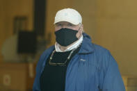 Michael Skakel arrives to a courthouse in Stamford, Conn., Friday, Oct. 30, 2020. Skakel, a Kennedy cousin, is expected at a court hearing as Connecticut prosecutors decide whether to retry him for the bludgeoning death of a fellow teenager in 1975. (AP Photo/Seth Wenig)