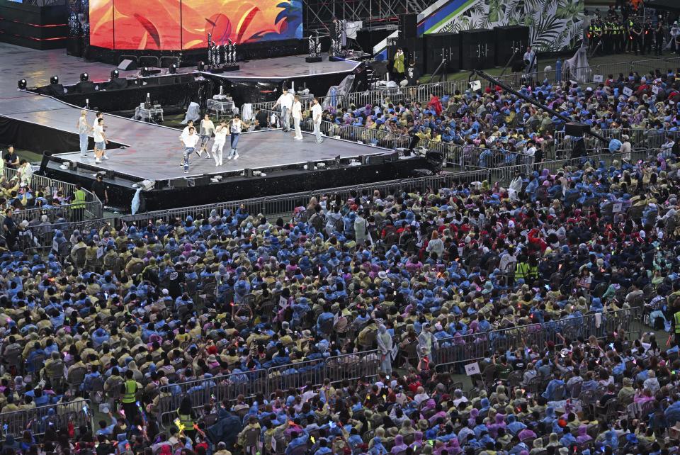 K-pop group The Boyz performs during a K-Pop concert after the closing ceremony of the World Scout Jamboree at the World Cup Stadium in Seoul, South Korea, Friday, Aug. 11, 2023. Flights and trains resumed and power was mostly restored Friday after a tropical storm blew through South Korea, which was preparing a pop concert for 40,000 Scouts whose global Jamboree was disrupted by the weather. (Korea Pool via AP)