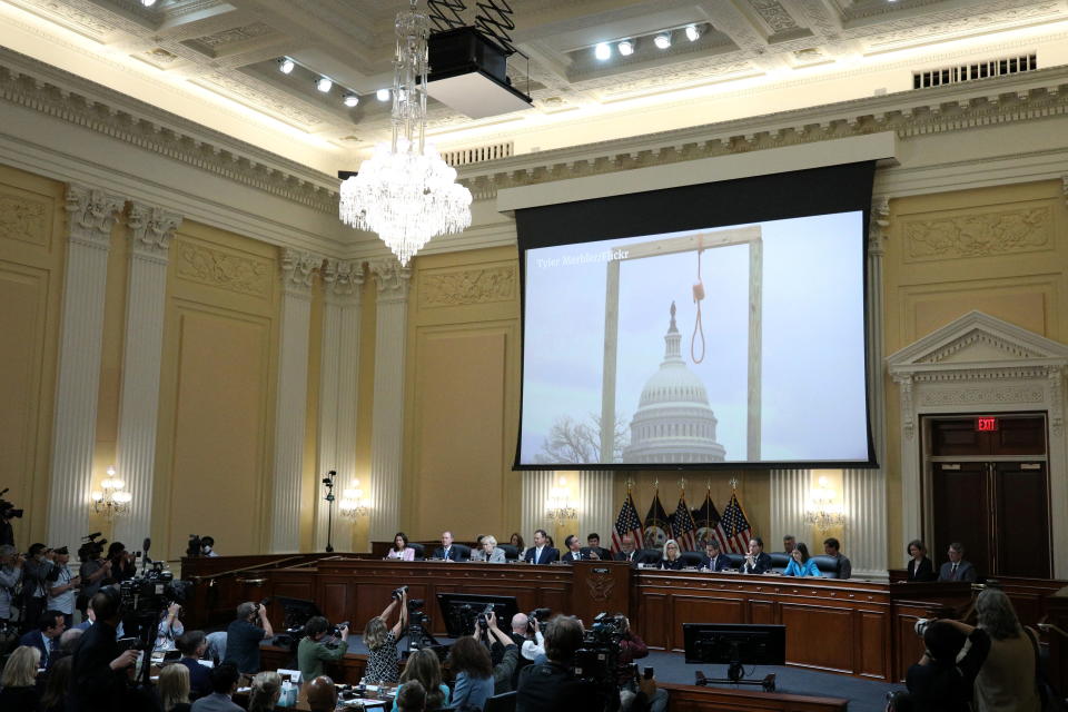 An image of a noose hanging near the Capitol on January 6, 2021, is displayed on a screen during a hearing of the January 6 committee.