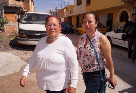 FILE PHOTO: Guadalupe Garcia de Rayos (R) walks along her mother days after she was deported to Nogales, Mexico, by U.S. immigration authorities, in the town of Acambaro, in Guanajuato state, Mexico February 15, 2017. REUTERS/Stringer/File Photo FOR EDITORIAL USE ONLY. NO RESALES. NO ARCHIVES.