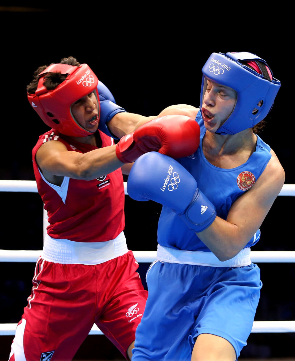LONDON, ENGLAND - AUGUST 06: Sofya Ochigava of Russia (Blue) competes against Alexis Pritchard (Red) of New Zealand during the Women's Light (60kg) Boxing Quarterfinals on Day 10 of the London 2012 Olympic Games at ExCeL on August 6, 2012 in London, England. (Photo by Scott Heavey/Getty Images)