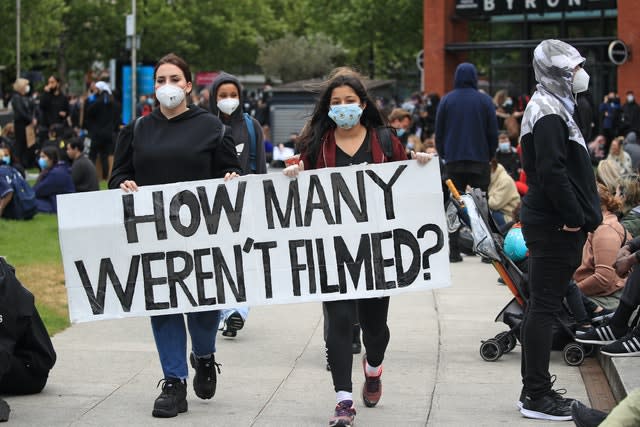 Protesters take part in a rally in Manchester's Piccadilly Gardens (Danny Lawson/PA Wire)