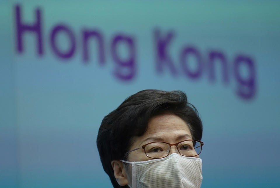 Hong Kong Chief Executive Carrie Lam listens to reporters' questions during a press conference in Hong Kong, Monday, March, 2021. Lam said Monday that the Hong Kong government "fully welcomes" the reforms to the city's electoral system, after Beijing proposed a major revamp that will increase central government control over Hong Kong politics. (AP Photo/Vincent Yu)