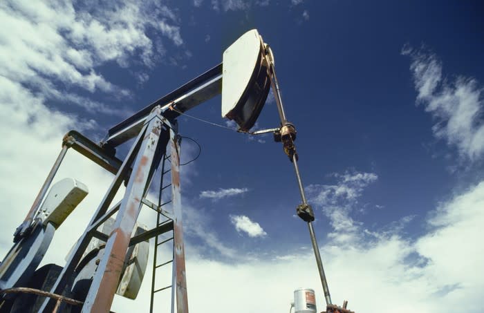 An oil pump with a blue sky in the background.