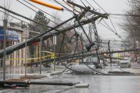 <p>Wind knocks down power poles onto Arsenal Street in Watertown, Mass., March 2, 2018. (Photo: Greg Cooper/EPA-EFE/REX/Shutterstock) </p>