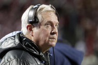 North Carolina coach Mack Brown watches a replay on the scoreboard during the first half of the team's NCAA college football game against North Carolina State on Friday, Nov. 26, 2021, in Raleigh, N.C. (AP Photo/Chris Seward)