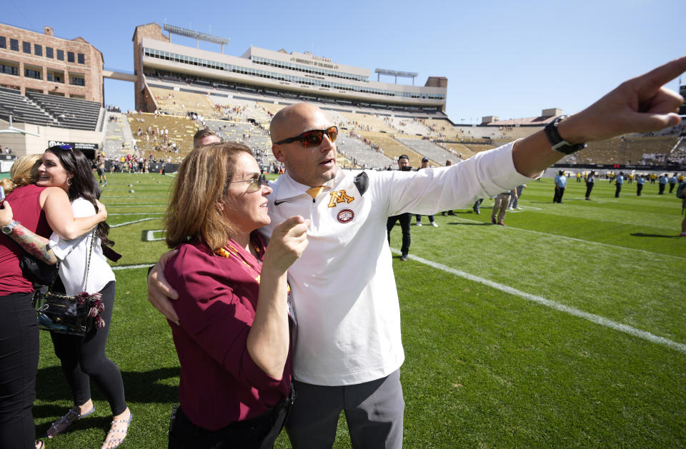 Minnesota head coach P.J. Fleck points to fans as he is congratulated after the second half of an NCAA college football game against Colorado, Saturday, Sept. 18, 2021, in Boulder, Colo. Minnesota won 30-0. (AP Photo/David Zalubowski)