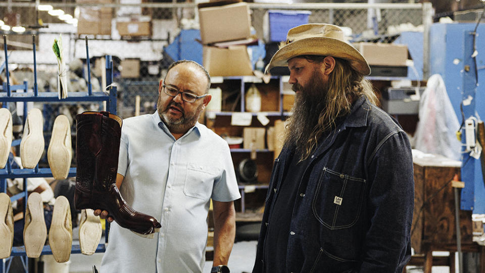 Stapleton, right, inspecting a pair of boots at Lucchese's El Paso, Texas factory.