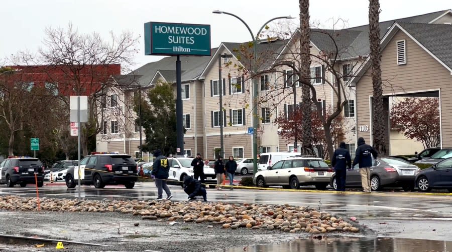 FBI agents and Oakland police officers look for evidence along Embarcadero in Oakland on Dec. 29, 2023 after an officer was fatally shot. (KRON4 image)